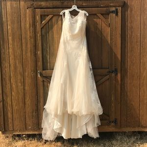 Absolutely gorgeous dress. Never worn. Ivory